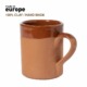 Taza de barro publicitaria